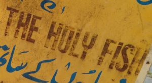 Site logo: 'Do Not Touch The Holy Fish' sign (Pahalgam, India)